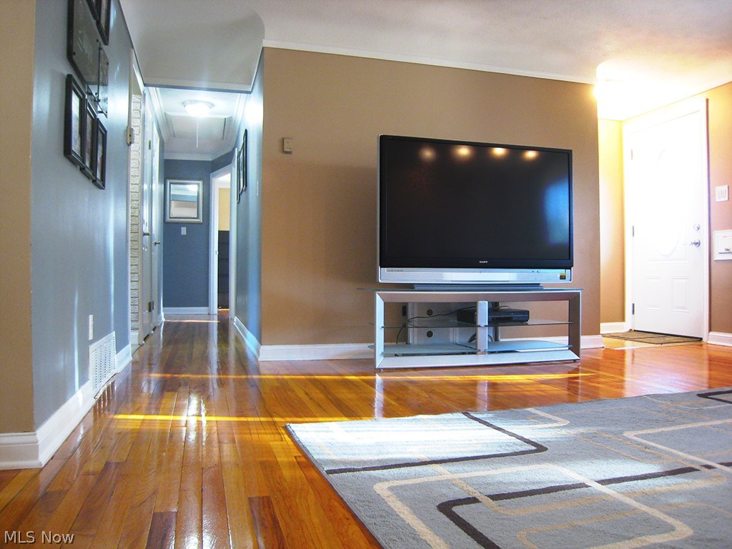 6925 Maplewood Road Parma Heights, OH 44130 - Photo 6 of 25 Large living room with beautiful hardwood floors.