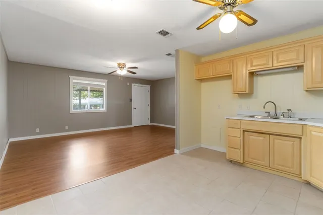 a view of a kitchen with a sink and cabinet