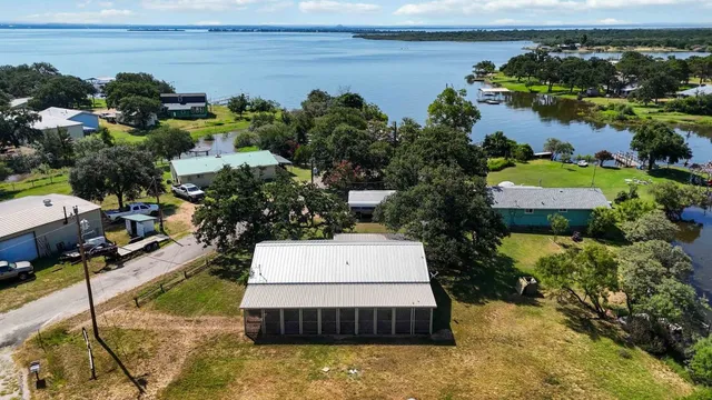 a swimming pool with some trees in the background