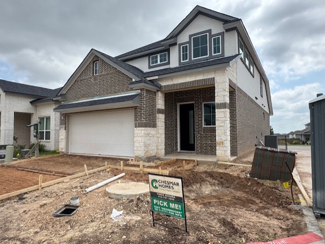 2705 Sage Ranch Drive, Unit 9 Leander, TX 78641 - Photo 1 of 1 a front view of a house with a yard