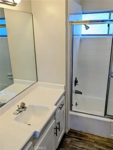 a bathroom with a tub and a sink