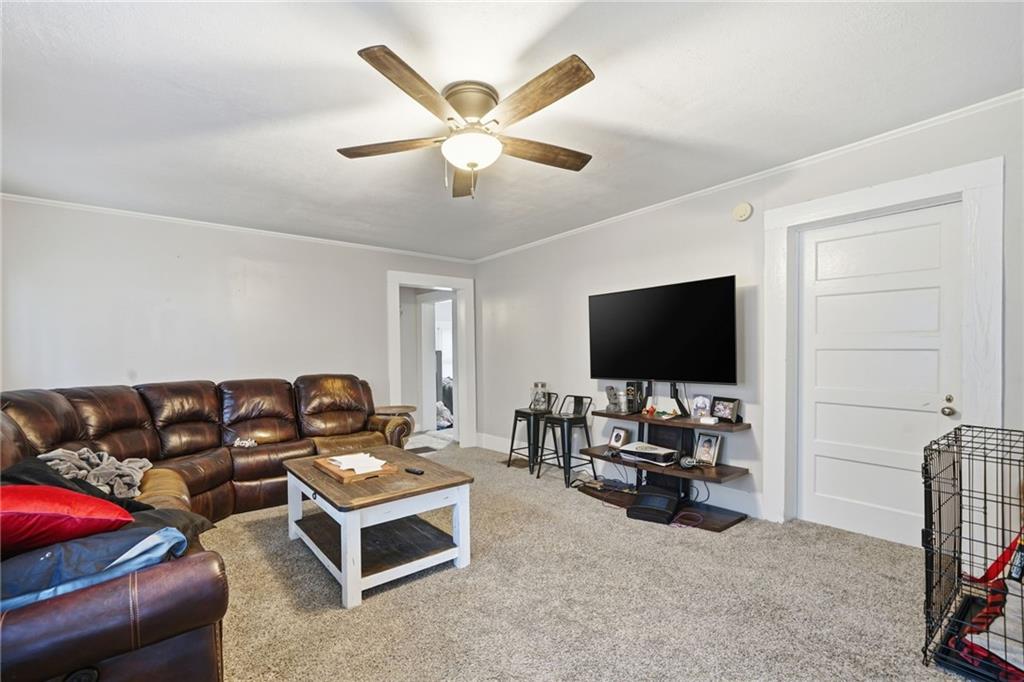 508 Old Canton Road Ball Ground, GA 30107 - Photo 12 of 28 a living room with furniture and a flat screen tv