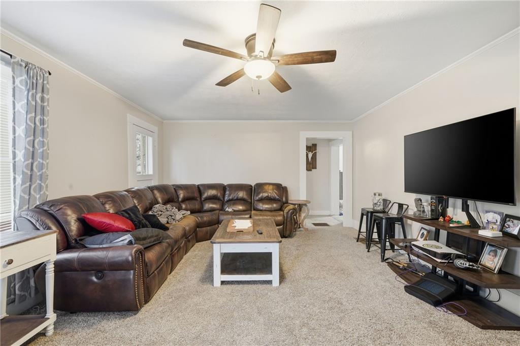 508 Old Canton Road Ball Ground, GA 30107 - Photo 13 of 28 a living room with furniture and a flat screen tv