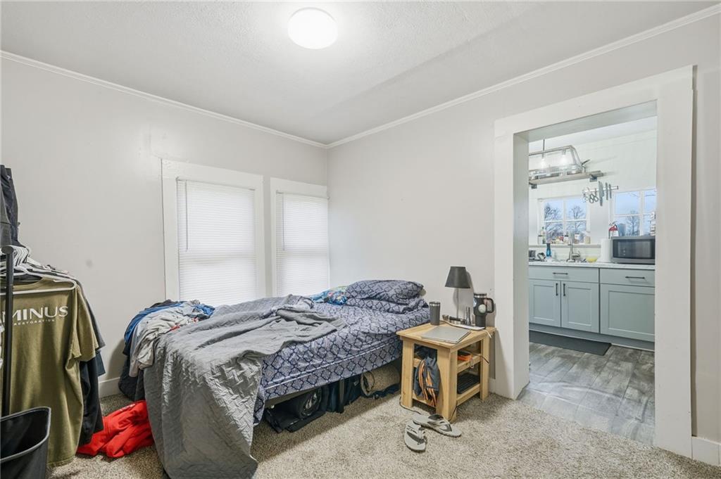 508 Old Canton Road Ball Ground, GA 30107 - Photo 15 of 28 a bedroom with a bed and a cabinets