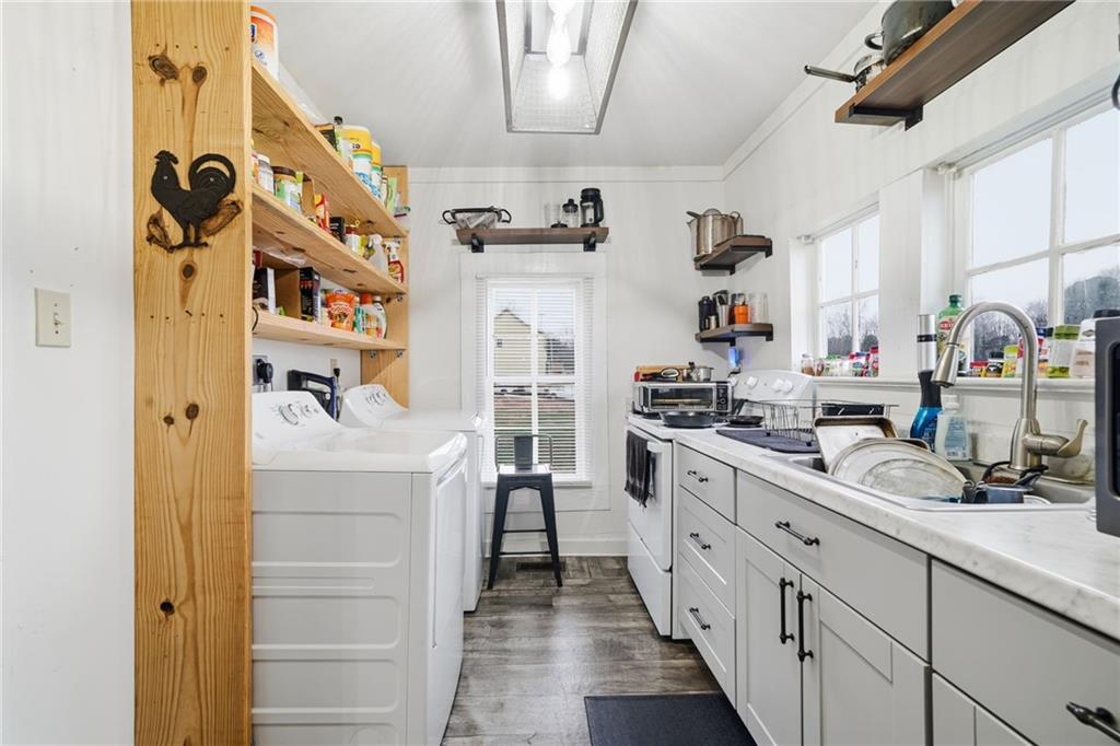 508 Old Canton Road Ball Ground, GA 30107 - Photo 18 of 28 a kitchen with cabinets and window