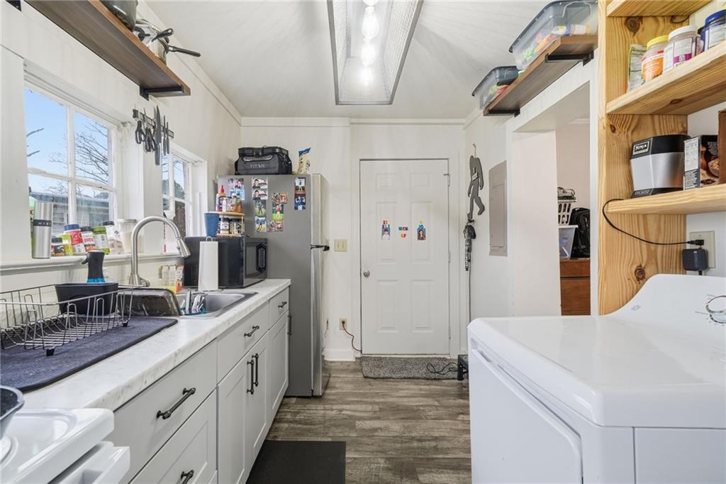 508 Old Canton Road Ball Ground, GA 30107 - Photo 21 of 28 a bathroom with a sink a toilet and shower