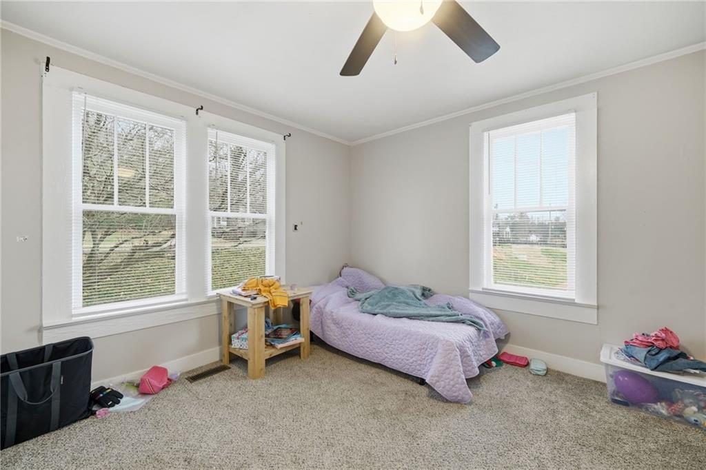 508 Old Canton Road Ball Ground, GA 30107 - Photo 24 of 28 a bedroom with a bed and a window