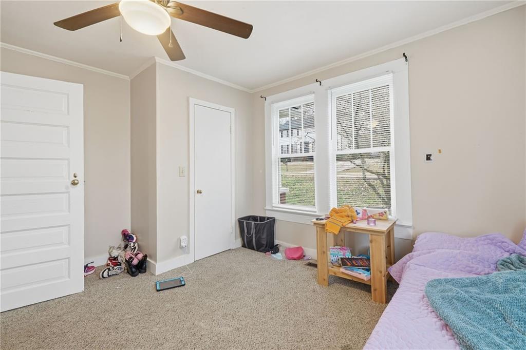 508 Old Canton Road Ball Ground, GA 30107 - Photo 26 of 28 a bedroom with furniture and a window