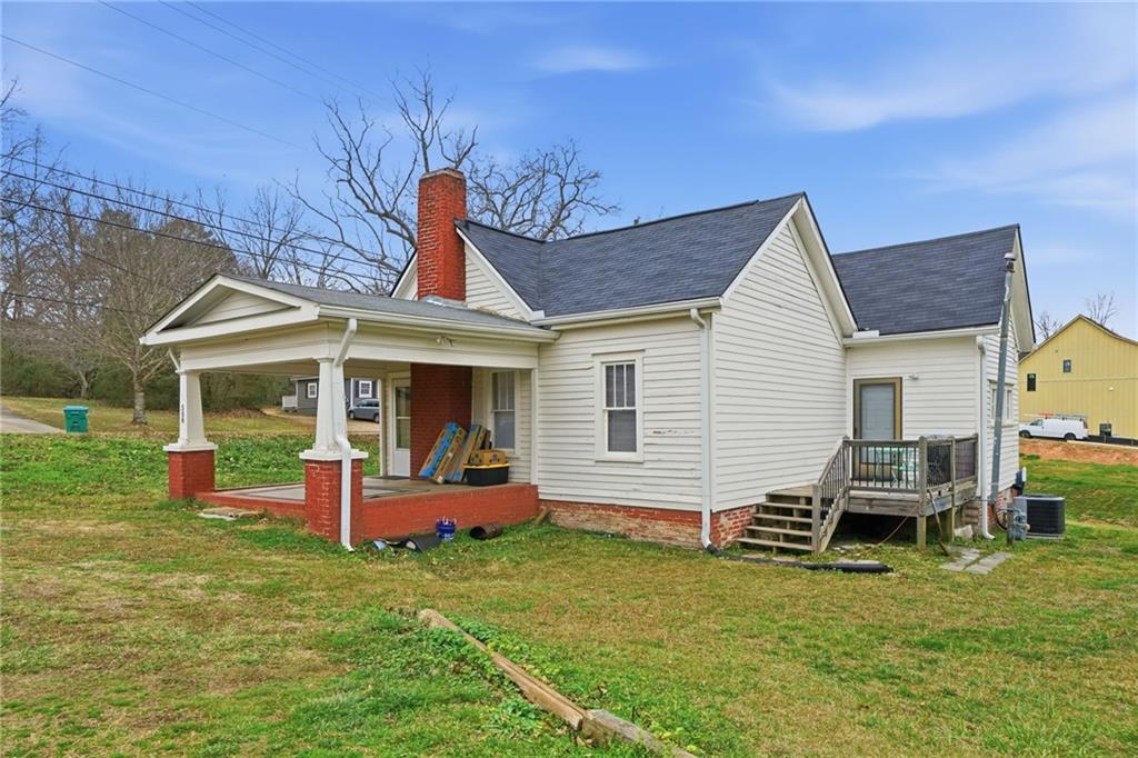 508 Old Canton Road Ball Ground, GA 30107 - Photo 3 of 28 a view of a house with a backyard