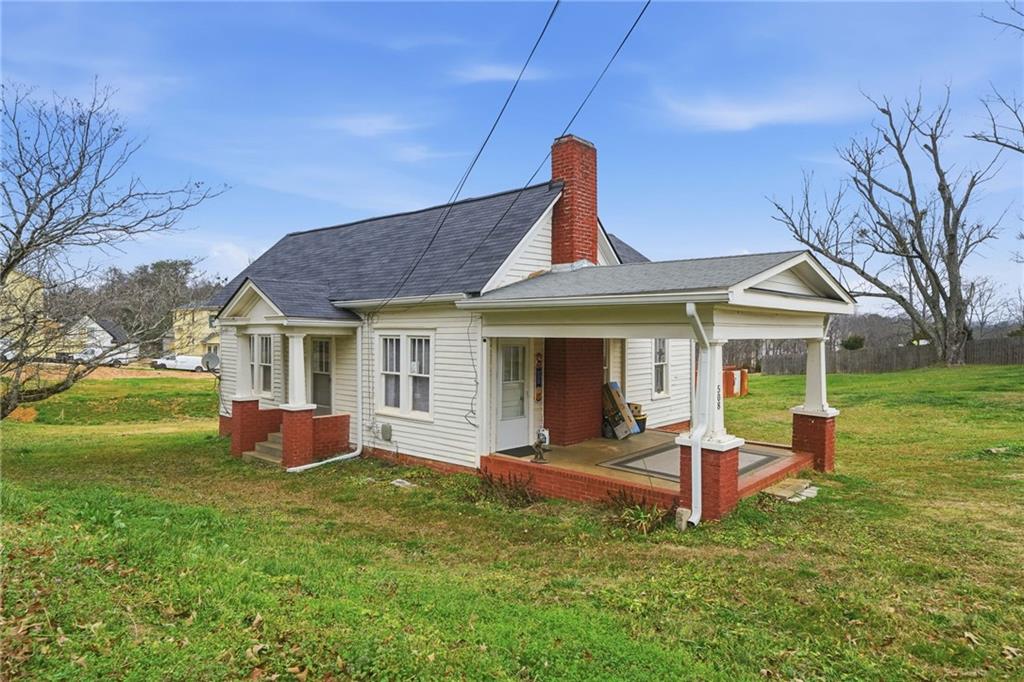 508 Old Canton Road Ball Ground, GA 30107 - Photo 4 of 28 a front view of a house with a yard