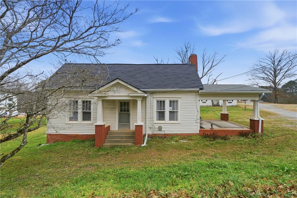 508 Old Canton Road Ball Ground, GA 30107 - Photo 5 of 28 a view of a house with a yard