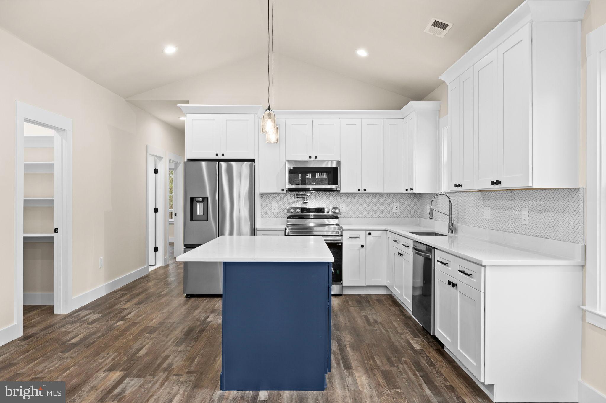 312 9th Street Colonial Beach, VA 22443 - Photo 59 of 62 Modern kitchen with sleek design elements.