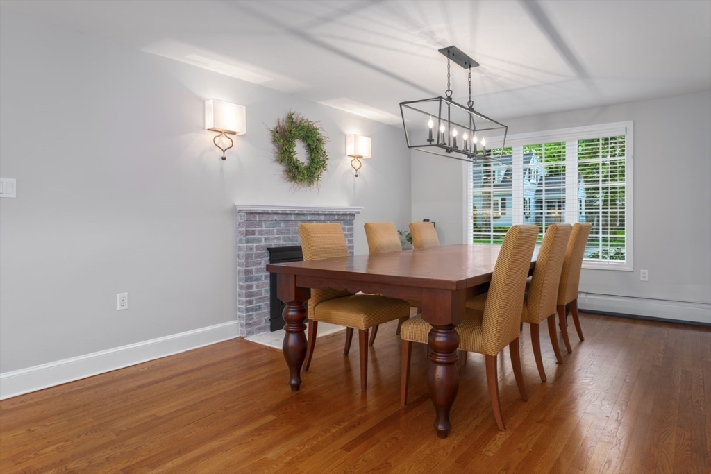 32 Sturges Road Reading, MA 01867 - Photo 16 of 39 a view of a dining room with furniture window and wooden floor