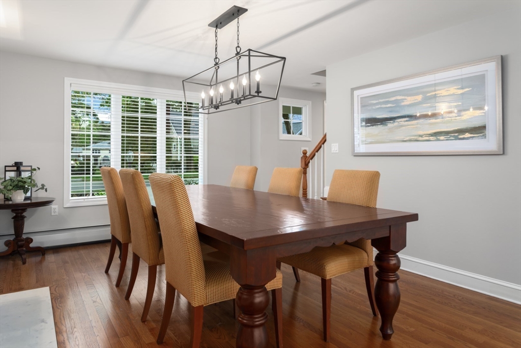 32 Sturges Road Reading, MA 01867 - Photo 18 of 39 a view of a dining room with furniture window and wooden floor