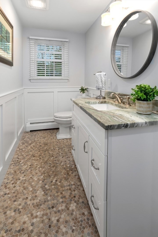 32 Sturges Road Reading, MA 01867 - Photo 26 of 39 a bathroom with a granite countertop sink and a mirror