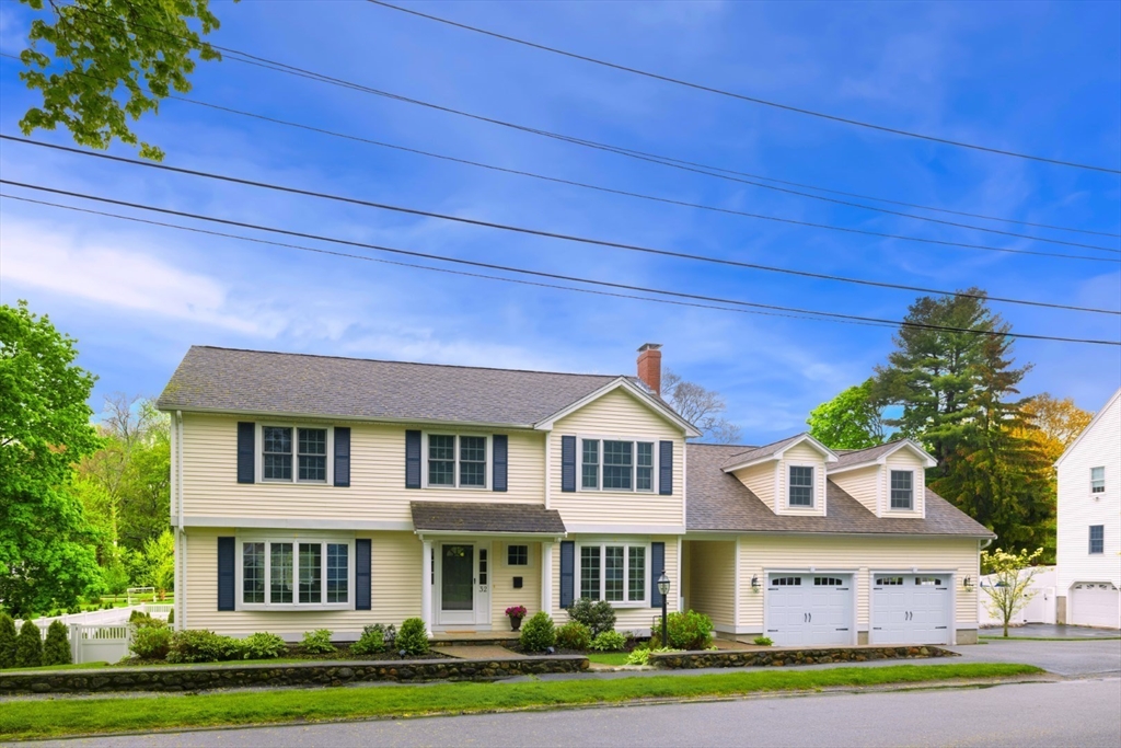 32 Sturges Road Reading, MA 01867 - Photo 3 of 39 a front view of residential houses with yard