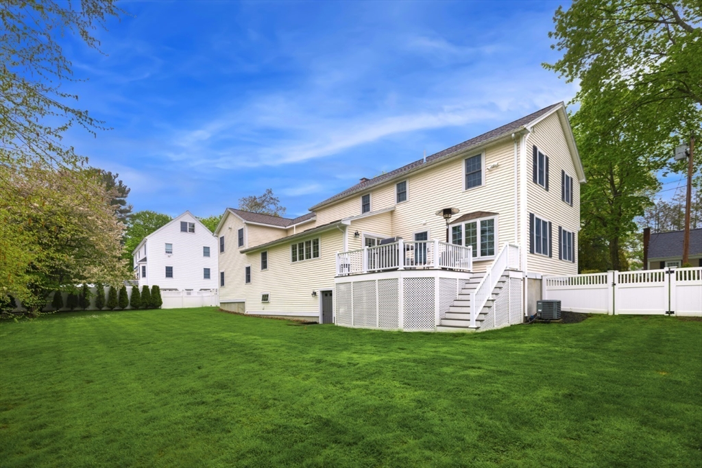 32 Sturges Road Reading, MA 01867 - Photo 37 of 39 a view of a white house with a big yard
