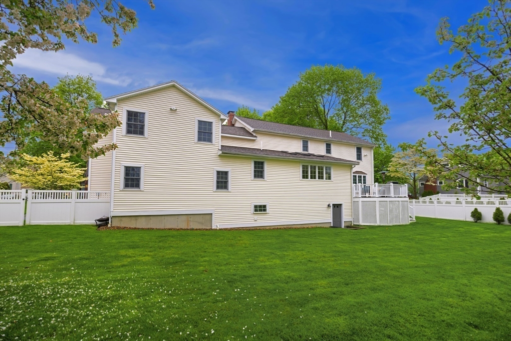 32 Sturges Road Reading, MA 01867 - Photo 38 of 39 a front view of a house with a yard and trees