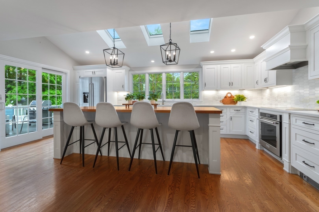32 Sturges Road Reading, MA 01867 - Photo 10 of 39 a view of a dining room with furniture window and wooden floor