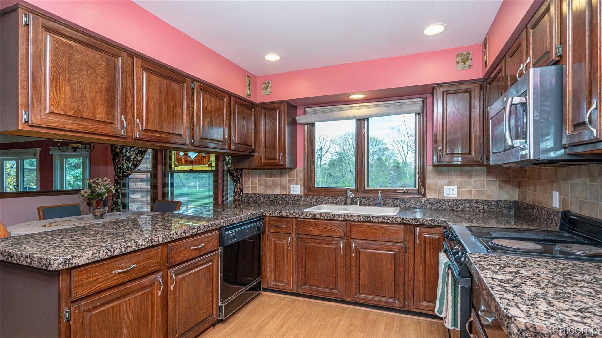 5330 Inverrary Lane Commerce Township, MI 48382 - Photo 27 of 76 Granite counters in kitchen.
