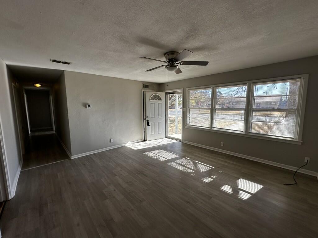 1602 39th Street Lubbock, TX 79412 - Photo 3 of 14 a view of an empty room with a window
