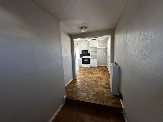 a view of an empty room with a window