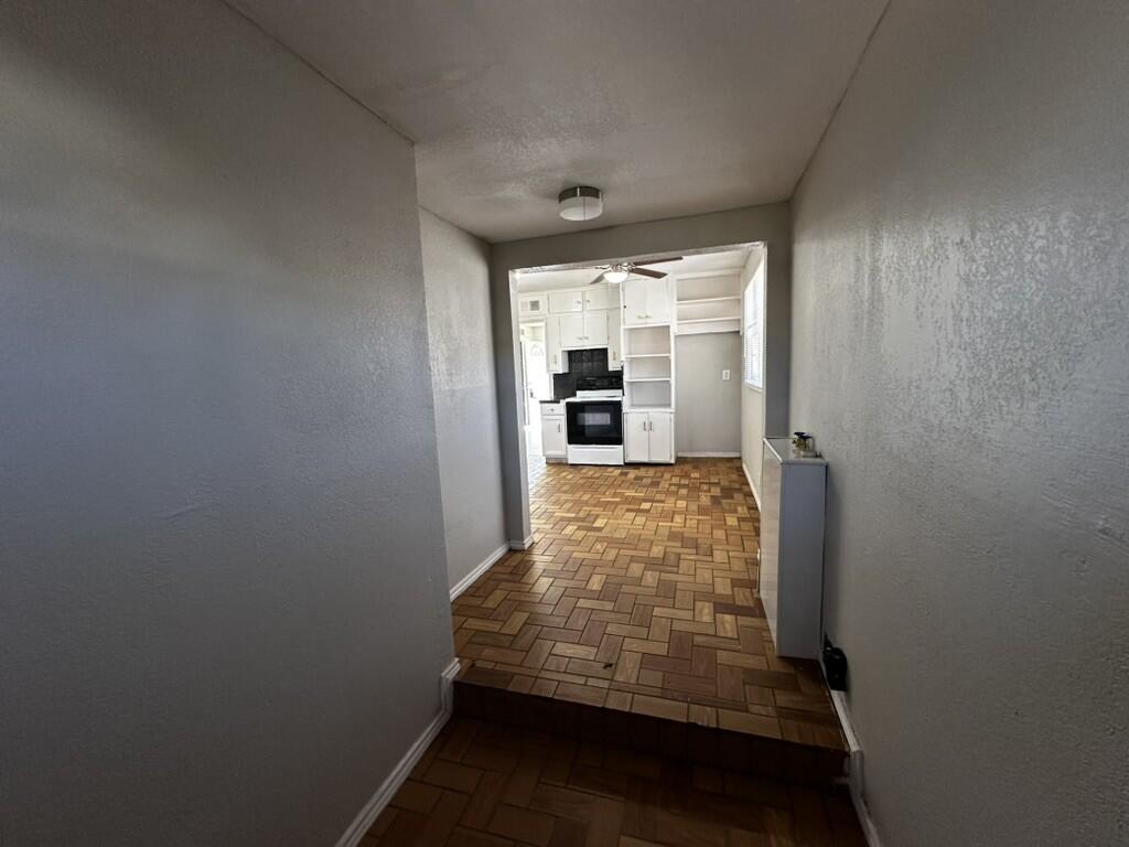 1602 39th Street Lubbock, TX 79412 - Photo 6 of 14 a view of entryway with wooden floor