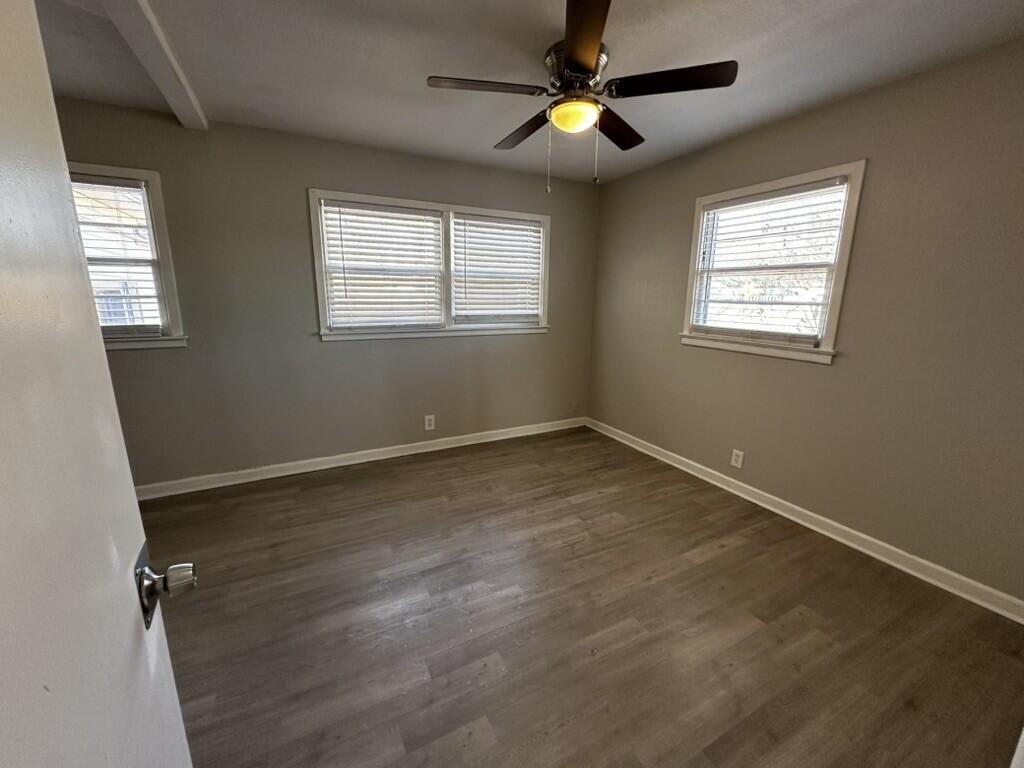 1602 39th Street Lubbock, TX 79412 - Photo 7 of 14 a view of an empty room with a window