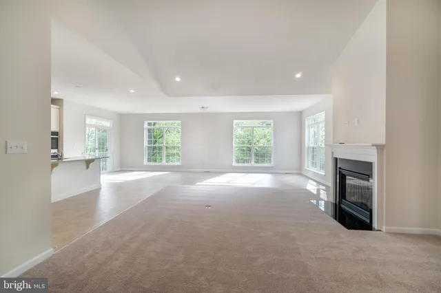 a view of empty room with a fireplace