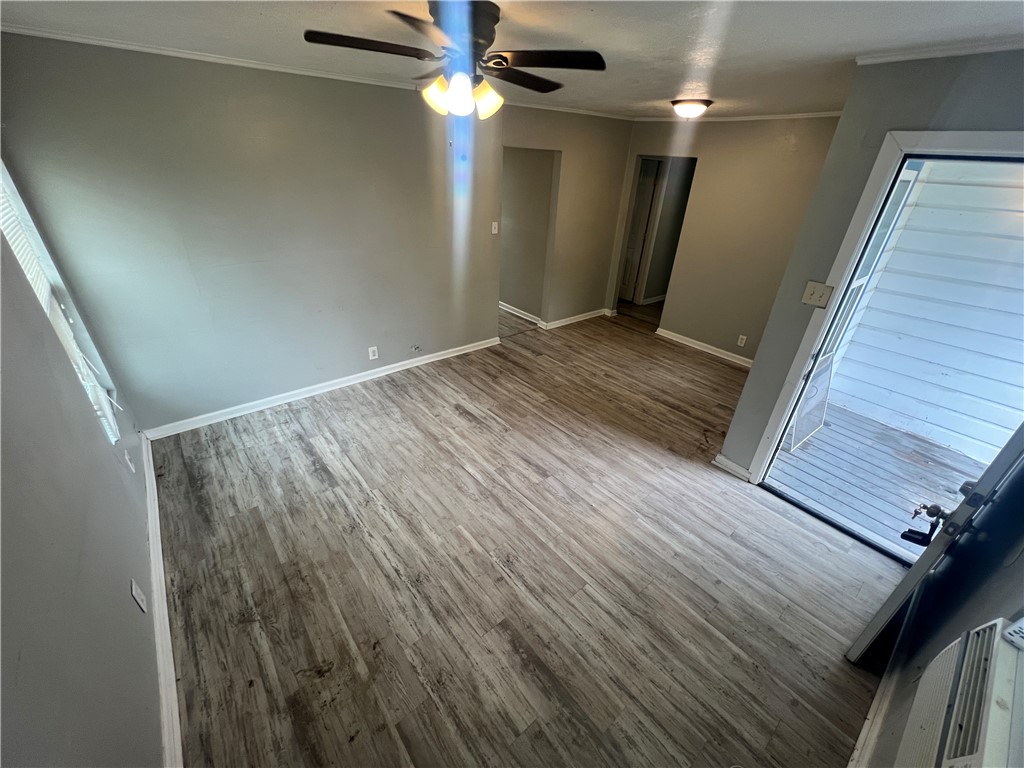 5564 Hampshire Road Corpus Christi, TX 78408 - Photo 3 of 7 a view of hallway with stairs and wooden floor