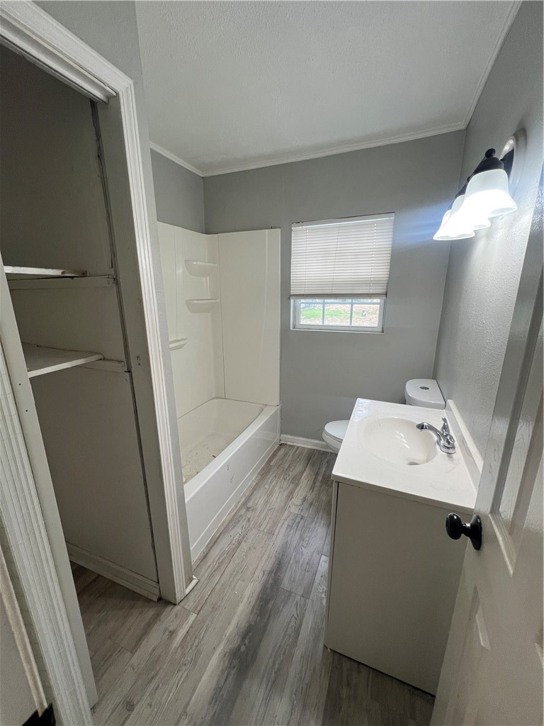 5564 Hampshire Road Corpus Christi, TX 78408 - Photo 6 of 7 a bathroom with a sink a mirror and a shower