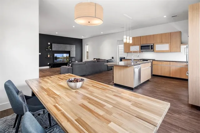 a kitchen with stainless steel appliances granite countertop a stove and a sink