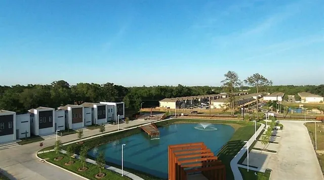 a view of a swimming pool with a table and chairs