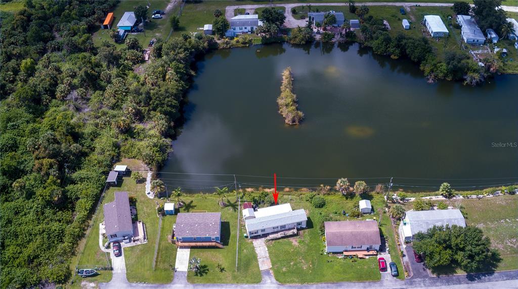 2811 Carl Avenue Punta Gorda, FL 33950 - Photo 2 of 8 an aerial view of residential house with outdoor space and swimming pool