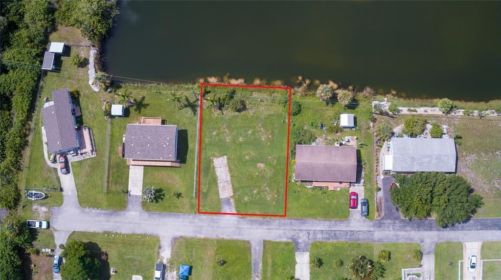 2811 Carl Avenue Punta Gorda, FL 33950 - Photo 3 of 8 an aerial view of a houses with yard
