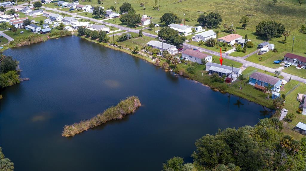 2811 Carl Avenue Punta Gorda, FL 33950 - Photo 7 of 8 a view of a lake with a house