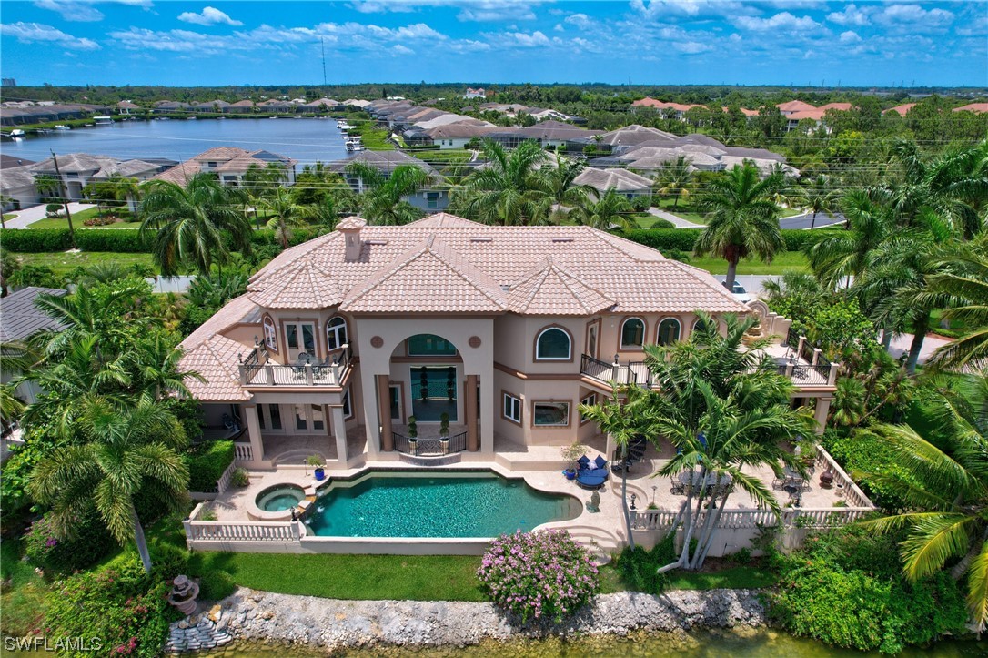 5960 Harborage Drive Fort Myers, FL 33908 - Photo 1 of 32 an aerial view of a house with garden space and outdoor seating