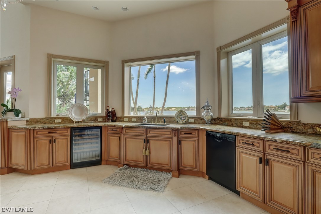 5960 Harborage Drive Fort Myers, FL 33908 - Photo 13 of 32 a large kitchen with granite countertop a sink and a stove