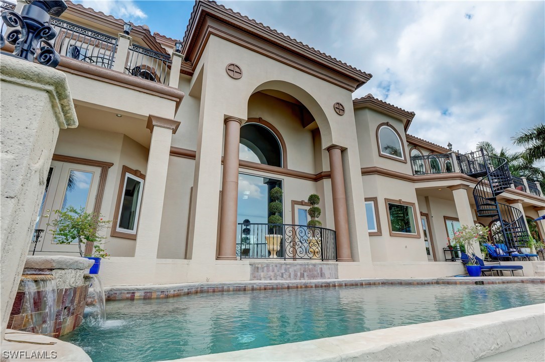 5960 Harborage Drive Fort Myers, FL 33908 - Photo 22 of 32 a front view of a house with garden