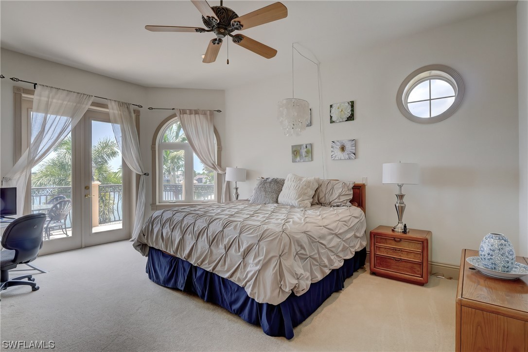 5960 Harborage Drive Fort Myers, FL 33908 - Photo 23 of 32 a spacious bedroom with a bed and window