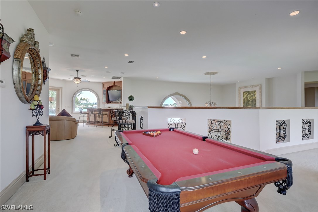 5960 Harborage Drive Fort Myers, FL 33908 - Photo 26 of 32 a room with furniture and a mirror