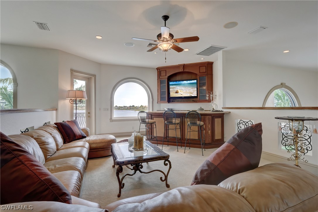 5960 Harborage Drive Fort Myers, FL 33908 - Photo 27 of 32 a living room with furniture and a chandelier