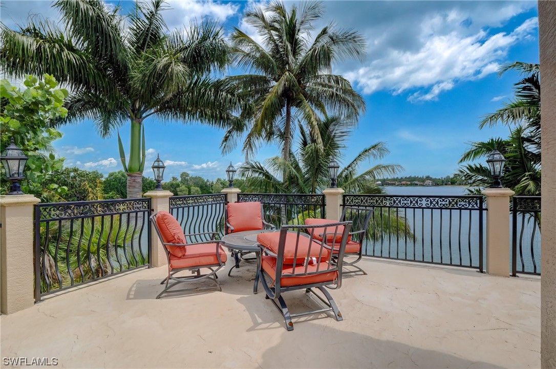 5960 Harborage Drive Fort Myers, FL 33908 - Photo 28 of 32 a row of palm trees in a patio