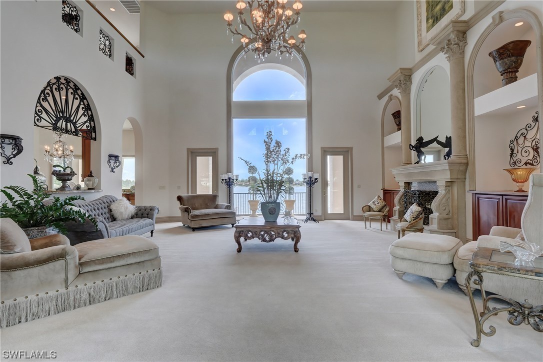 5960 Harborage Drive Fort Myers, FL 33908 - Photo 3 of 32 a living room with furniture and a chandelier