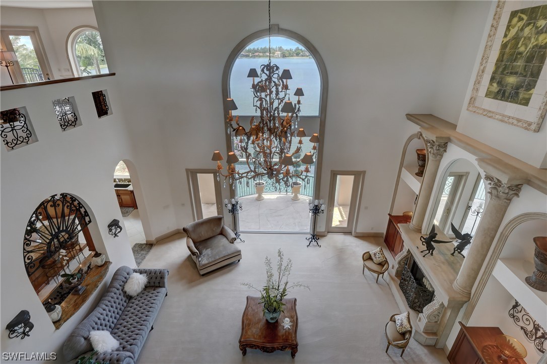 5960 Harborage Drive Fort Myers, FL 33908 - Photo 32 of 32 a living room with furniture and a chandelier