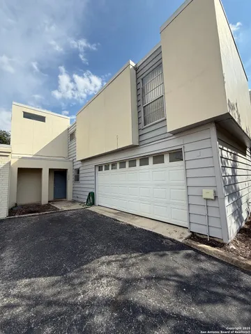 a view of a house with a garage