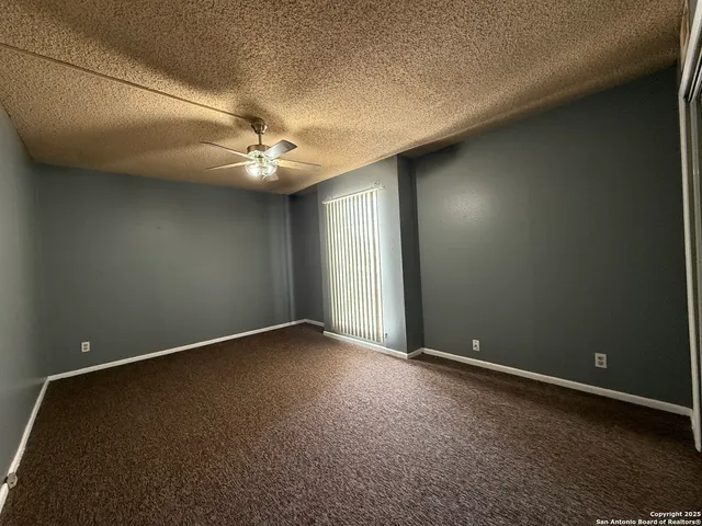 a view of a room that has a window in it