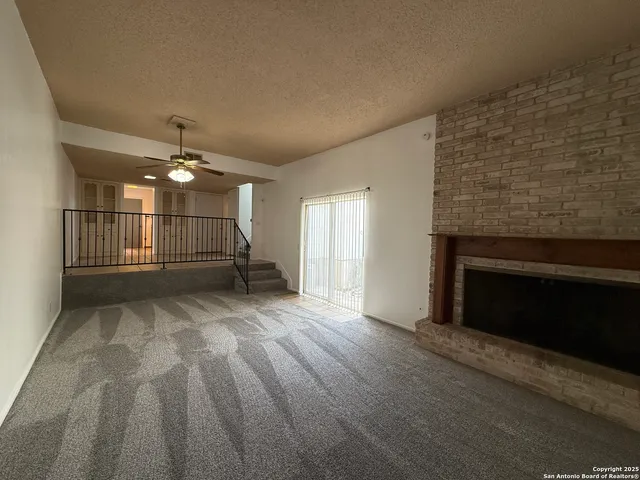 a kitchen with a sink a counter top space and stainless steel appliances