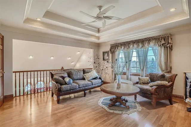a spacious bathroom with a granite countertop sink mirror and bathtub