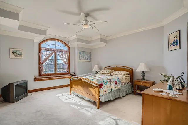 a living room with furniture and book shelf